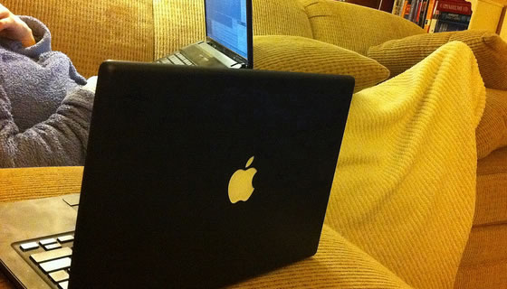 Black MacBook laptop featured image